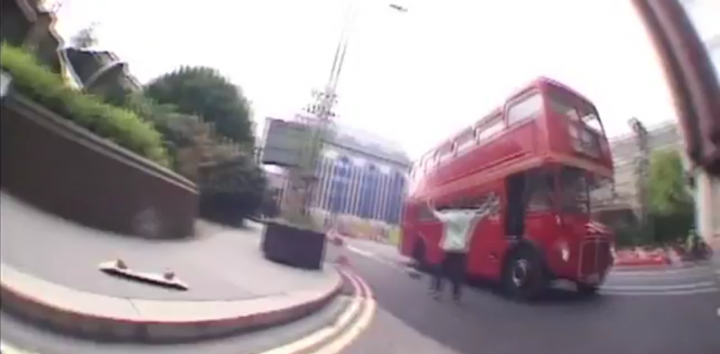 Skateboarder Almost Hit by Double Decker Bus